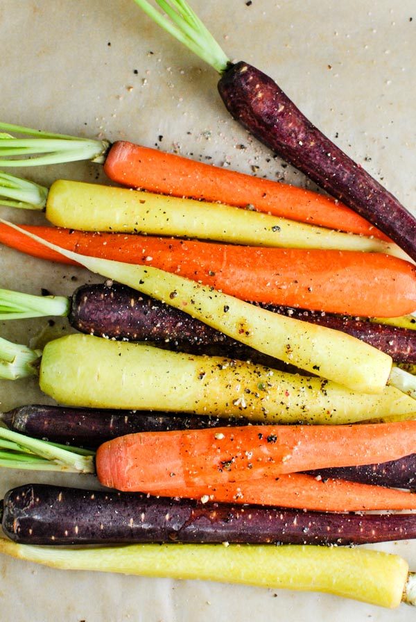 a quick and easy whole30 side recipe! whole30 roasted rainbow carrots! we love them because they get a little bit sweet and caramel-y and wonderful | thepikeplacekitchen.com