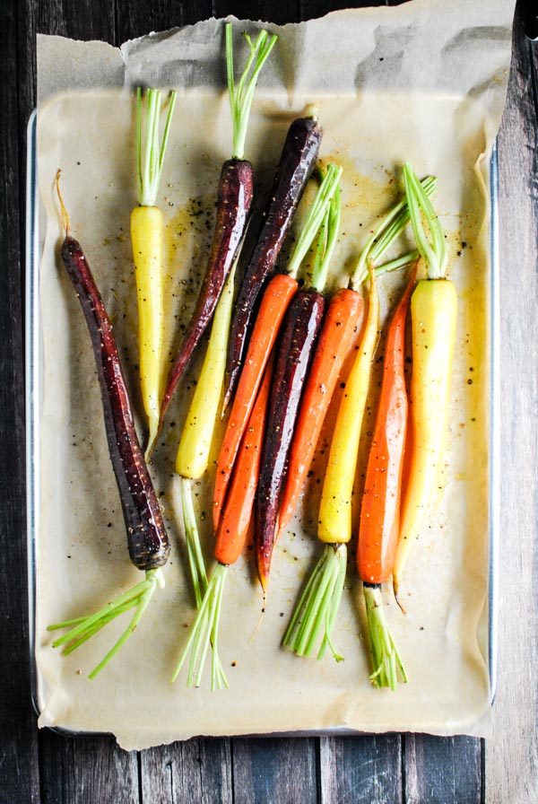 a quick and easy whole30 side recipe! whole30 roasted rainbow carrots! we love them because they get a little bit sweet and caramel-y and wonderful | thepikeplacekitchen.com