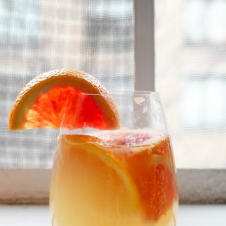 LOOK AT THAT GLASS! SO BRIGHT AND COLORFUL AND DELICIOUS. and just make this white citrus sangria because YUM. | thepikeplacekitchen.com